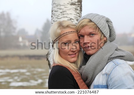 beautiful romantic couple outside in warm clothing