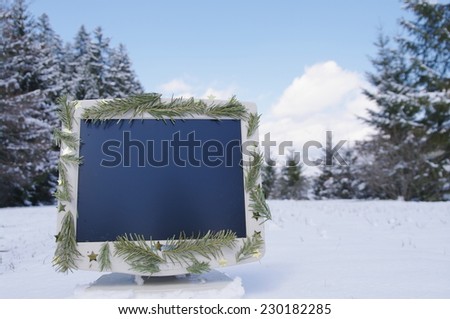 a decorated screen in snowy winter landscape
