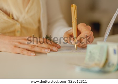 Business woman Signing a cheque