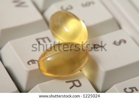 pills on a computer keyboard near to euro and dollar sign as a symbol for online pharmacy