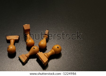 wooden stamps in dramatic lighting
