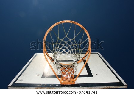 basketball basket against blue sky on a sunny day