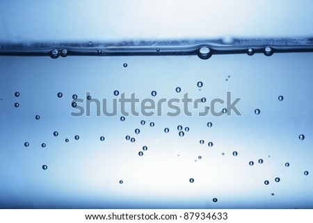 close up of water bubbles in a glass