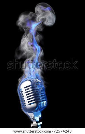 stock photo old mic in blue flames isolated on black