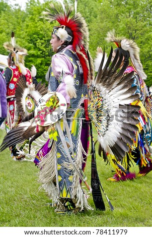 OTTAWA, CANADA - MAY 28: Unidentified aboriginal men and women dancers in full dress and head regalia during the Powwow festival at Ottawa Municipal Campground in Ottawa Canada on May 28, 2011.