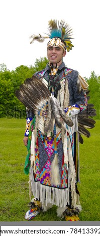 OTTAWA, CANADA - MAY 28: Unidentified aboriginal young man in full dress and head regalia during the Powwow festival at Ottawa Municipal Campground in Ottawa Canada on May 28, 2011.