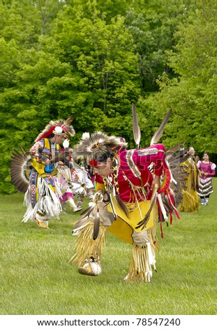 OTTAWA, CANADA - MAY 28: Unidentified aboriginal dancers in full dress and head regalia during the Powwow festival at Ottawa Municipal Campground in Ottawa Canada on May 28, 2011.