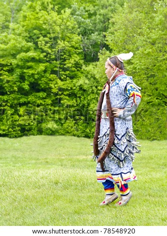 OTTAWA, CANADA - MAY 28: Unidentified aboriginal woman in full dress regalia during the Powwow festival at Ottawa Municipal Campground in Ottawa Canada on May 28, 2011.