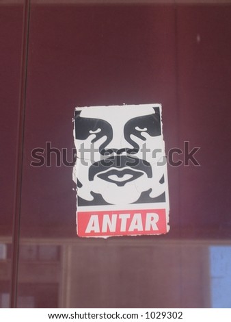 Sticker of the Middle Eastern equivalent to Obey the Giant