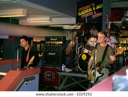 Green Day playing an in-store performance at Tower Records in the East Village of Manhattan just before trashing the store