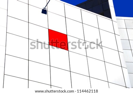 Lonely asymmetric red tile white building wall abstract