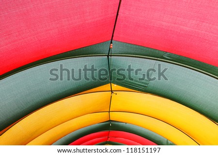Old colorful striped tent upward view background