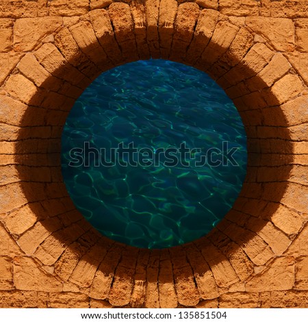Old stone well with a deep water top view
