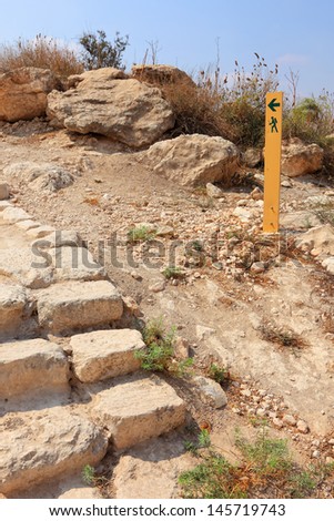 Sand stone ladder and movement directional marker in stone desert