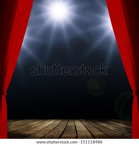 Red concert curtain and spots lighting over dark background and wood floor