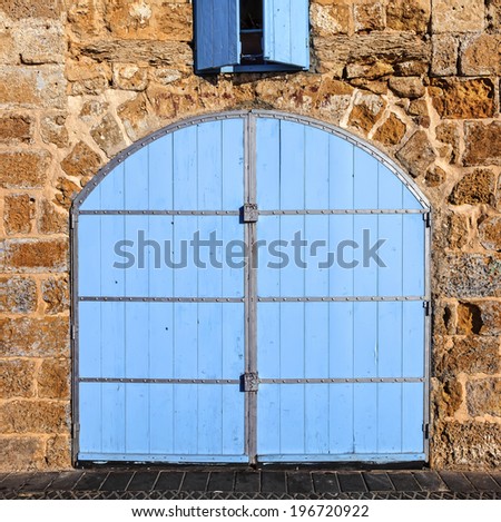Wooden forged locked doors (gate) of the old Mediterranean house.Tel Aviv, Israel