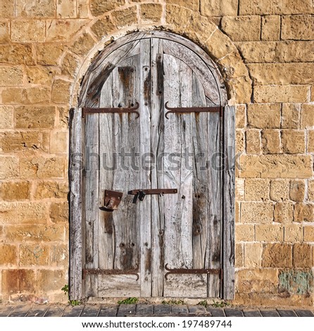 Wooden forged closed doors (gate) of the old Mediterranean house.Tel Aviv, Israel