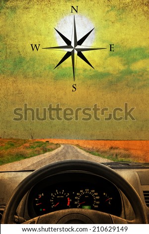 Textured old paper sunshine background with wind rose, wheel and dashboard of a car.  Retro style image