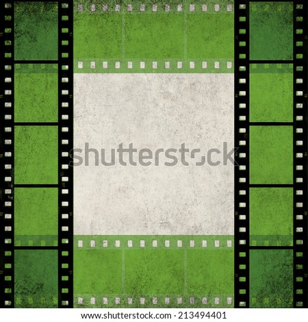 Textured old paper background with green  films strip frame  -  Vintage film stripe abstract background