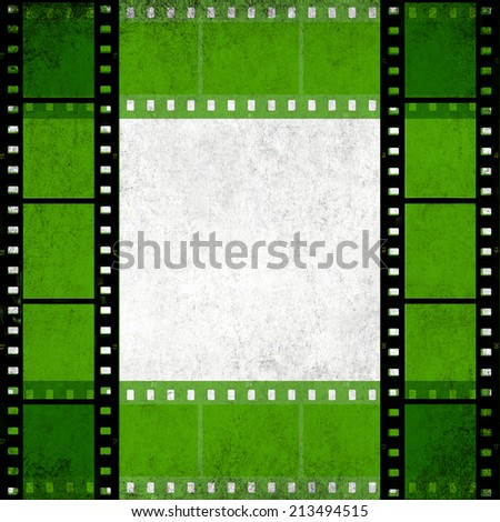 Textured old paper background with green films strip frame  -  Vintage film stripe abstract background