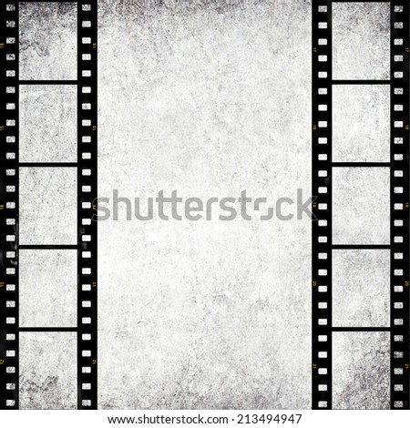 Textured old paper background with films strips  -  Vintage film stripe abstract background