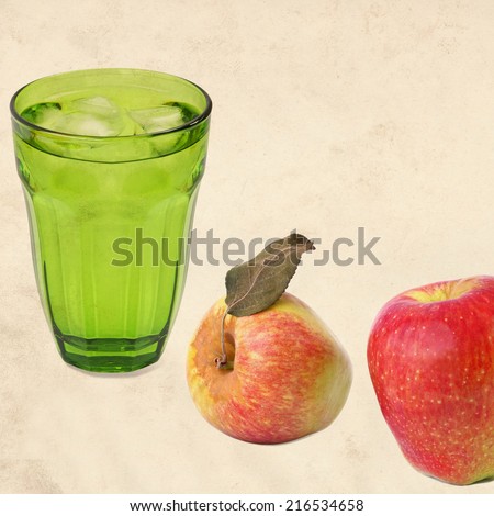Textured old paper background with ripe apples and drink glass with ice cooled drink (water) still life. Vintage style image