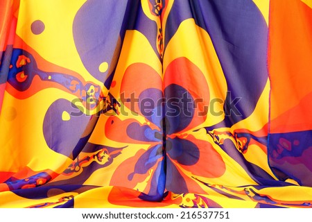 Yellow geometrical pattern drapery (creased) fabric background or texture