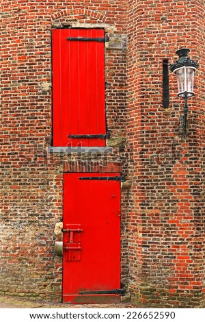 Red doors of the old red brick tower