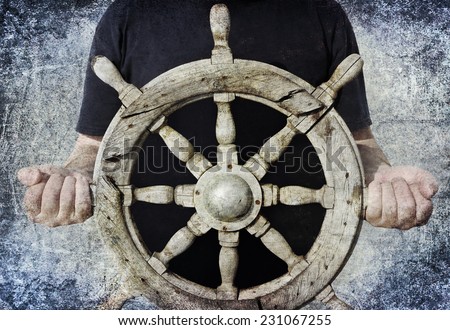 Textured old paper background with old steering wheel in sailor hands. Paper texture. Aged textured photo in retro style