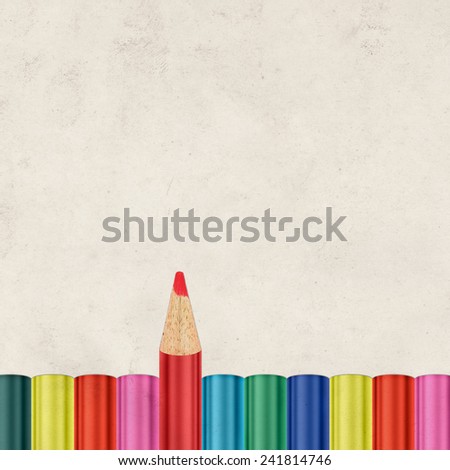 Textured paper and drawing pencils background