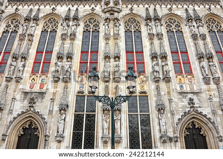 BRUGES, BELGIUM -OCTOBER, 10: Historic house with sculptures on the Grote Markt  (Market Square) of historic city center of Bruges is a prominent World Heritage Site of UNESCO on October,10, 2014.