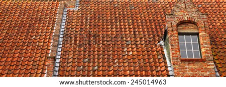 Ancient red tile roof and window background