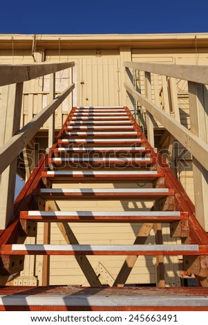 Wood stairs going up to a rescuer beach house