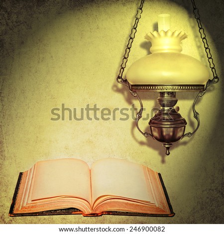 Open book and lamp light abstract textured background. Education light doctrine