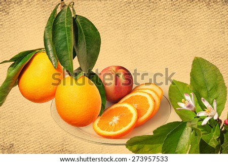 Ripe orange fruits on a branch, citrus flowers on the tree and orange fruit sliced on a the plate ready for eating. Vintage tone canvas fabric textured background