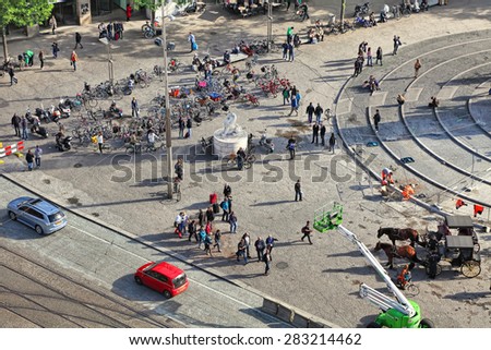 AMSTERDAM,NETHERLANDS,OCTOBER 10,2014:Top view from a ferris wheel on Dam Square (Royal Square)-favorite meetings place and attractions for tourists and citizens.Dam Square in Amsterdam, Netherlands