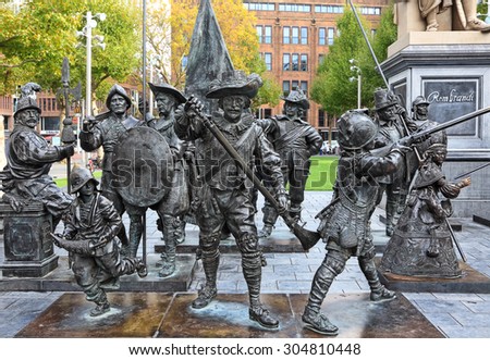 AMSTERDAM,NETHERLANDS - OCTOBER 10,2014 : Monument to famous painter Rembrandt and sculptures of his picture \