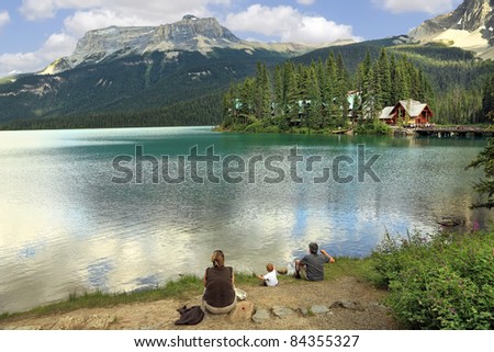 Family on the bank of Emerald lake (Yoho National park. Alberta. Canada)