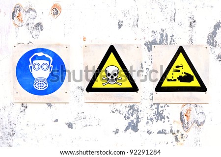 Warning signs on a warehouse door of chemical substances
