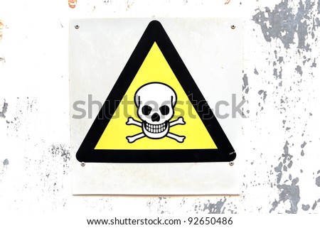 Warning sign on a warehouse door of danger to life