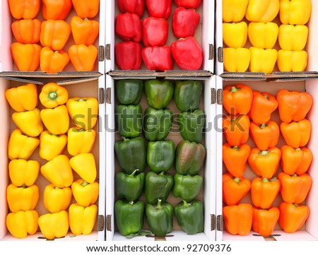 Colored paprika (pepper) in cardboard the boxes, exposed for sale