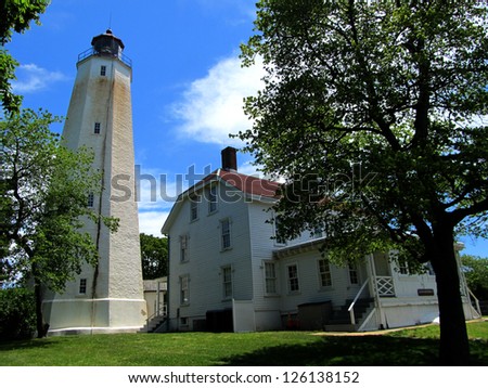 The Sandy Hook Lighthouse and light keeper\'s house in Sandy Hook, NJ.  The lighthouse was built in 1764 and has been in continuous use.  Today it is part of Gateway National Recreation Area.