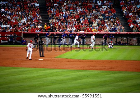 ANAHEIM, CA - AUGUST 3: Angels pitcher Jared Weaver slips and falls as he tries to make the play at first in a game against the Texas Rangers August 3, 2006 in Anaheim, CA.