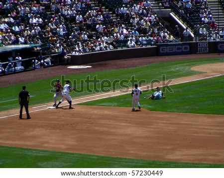 DENVER - JUNE 29: Byung-Hyun Kim, the Rockies pitcher, slips and falls as he tries to make the play at first base in a game at Coors Field against the Houston Astros June 29, 2005 in Denver, Colorado