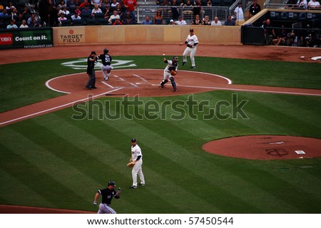 MINNEAPOLIS - JULY 17:  After Alex Rios of the White Sox scored, catcher Drew Butera of the Twins attempts to throw out Paul Konerko at second base at Target Field July 17, 2010 in Minneapolis, MN.