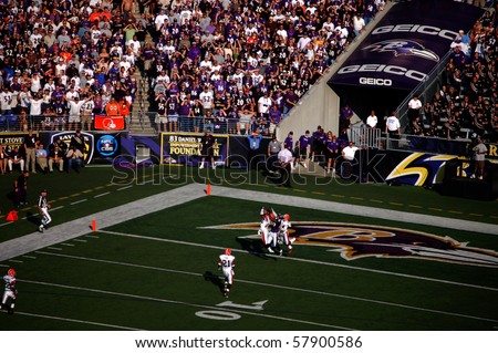 BALTIMORE - SEPTEMBER 21: Players from the Cleveland Browns and Baltimore Ravens jump for a Hail Mary pass at the end of the half at M&T Bank Stadium September 21, 2008 in Baltimore, MD