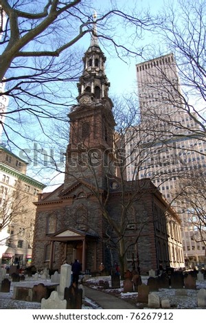 NEW YORK - MARCH 5: Visitors to St. Paul\'s Chapel walk near its entrance on March 5, 2006 in New York City. The chapel and the surrounding burial ground are part of Trinity Church which is located across from the World Trade Center in lower Manhattan.