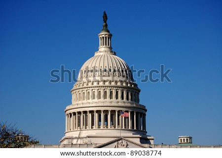 The bronze Statue of Freedom stands atop the cast iron dome of the United States Capitol building in Washington, D.C.  The dome was designed by Thomas U. Walter and the statue by Thomas Crawford.