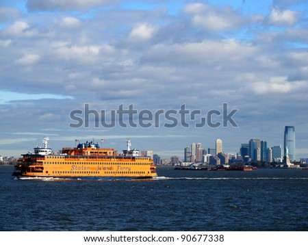 NEW YORK, NY - OCTOBER 21: Staten Island Ferry passes Jersey City, NJ and the Statue of Liberty on its way from New York to Staten Island on October 21, 2011 in New York, NY. Passengers ride for free.