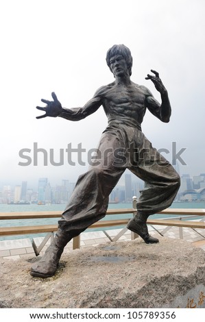 HONG KONG, CHINA - APR 17: Bruce Lee Statue in Avenue of Stars on April 17, 2012 in Hong Kong, China. The promenade honors celebrities of the Hong Kong film industry as the famous city attraction.